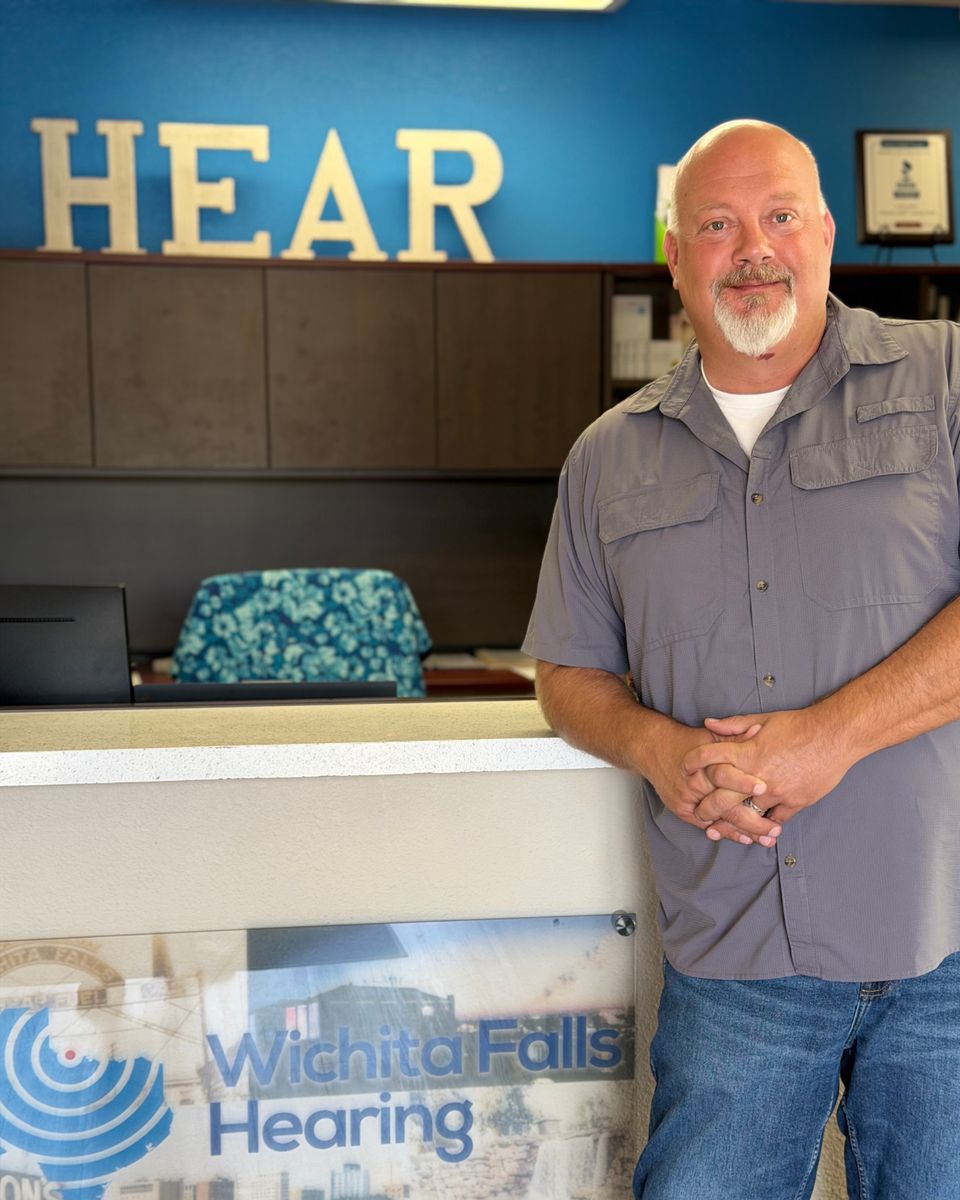 Dusty Potter at the front desk of Wichita Falls Hearing, his practice in Wichita Falls, Texas.